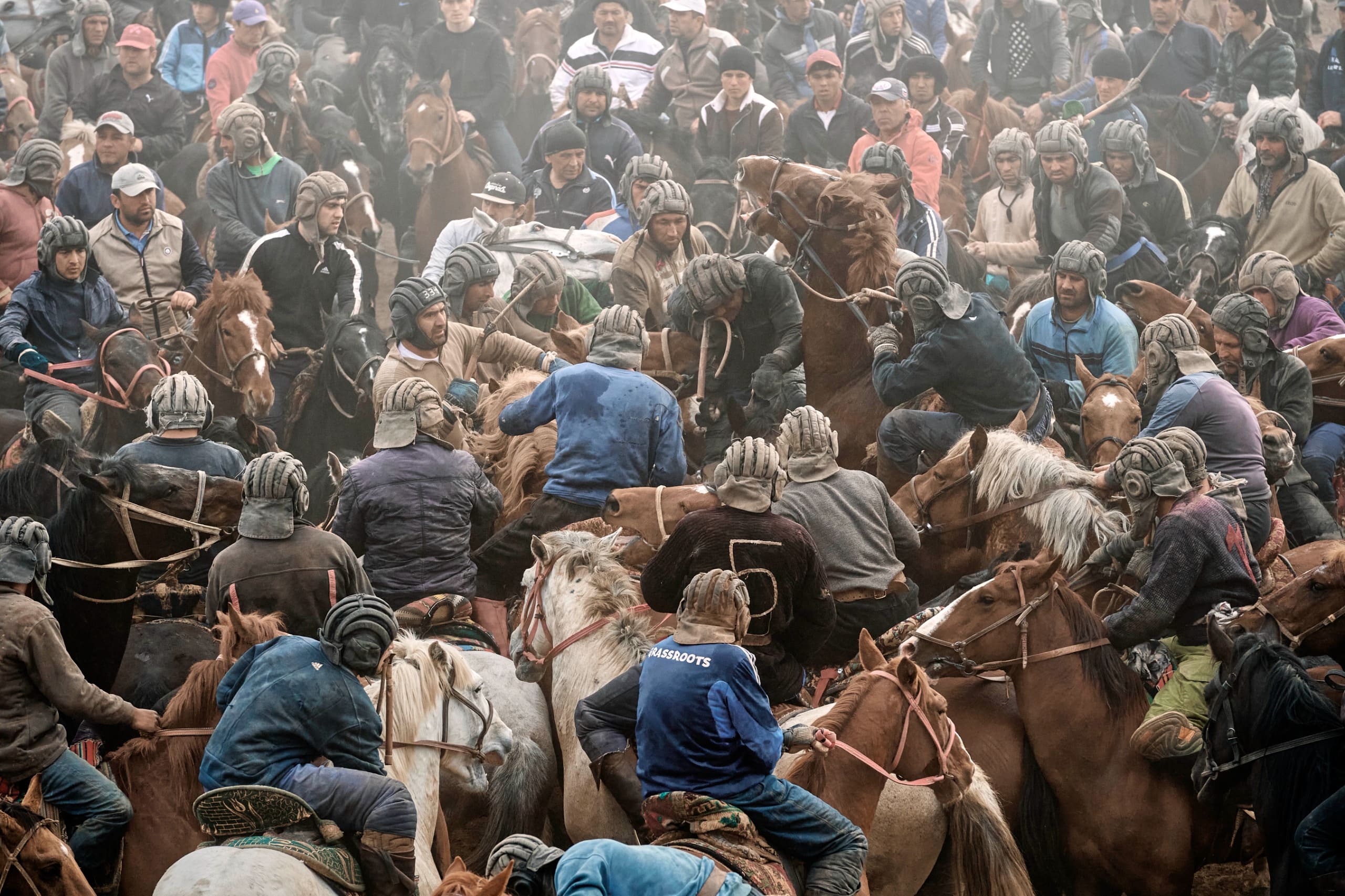 Horsemen competing in a high-energy Central Asian equestrian match